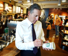 Starbucks CEO Howard Schultz signs the first “racetogether” cup.